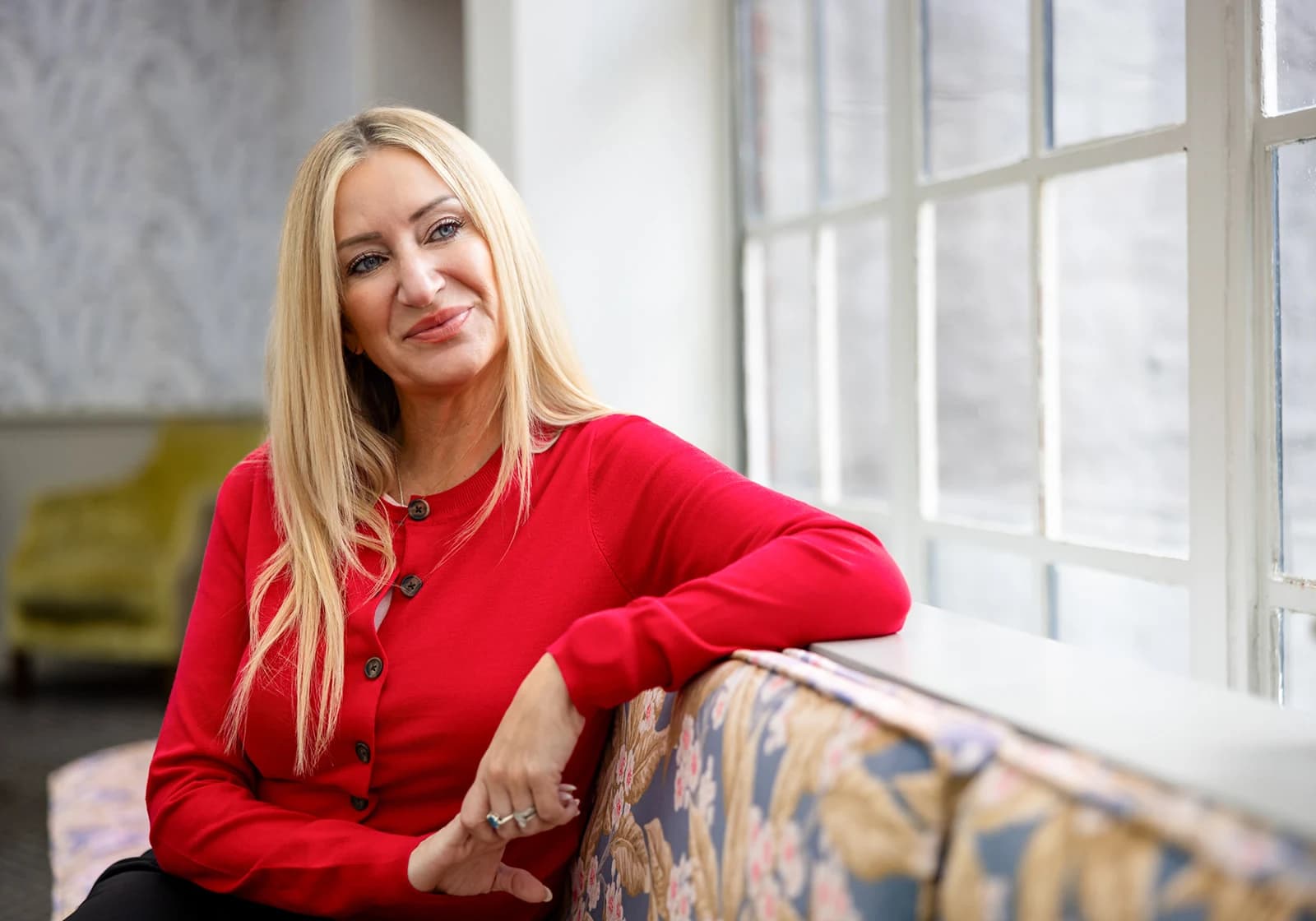 Gemma seated beside a window at the Maids Head Hotel